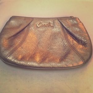 Small gold Coach Clutch